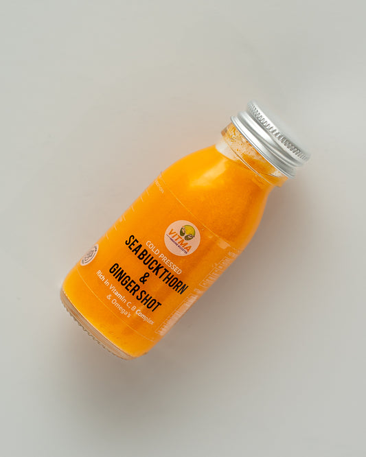 Bottle of Sea Buckthorn & Ginseng juice on a light gray background