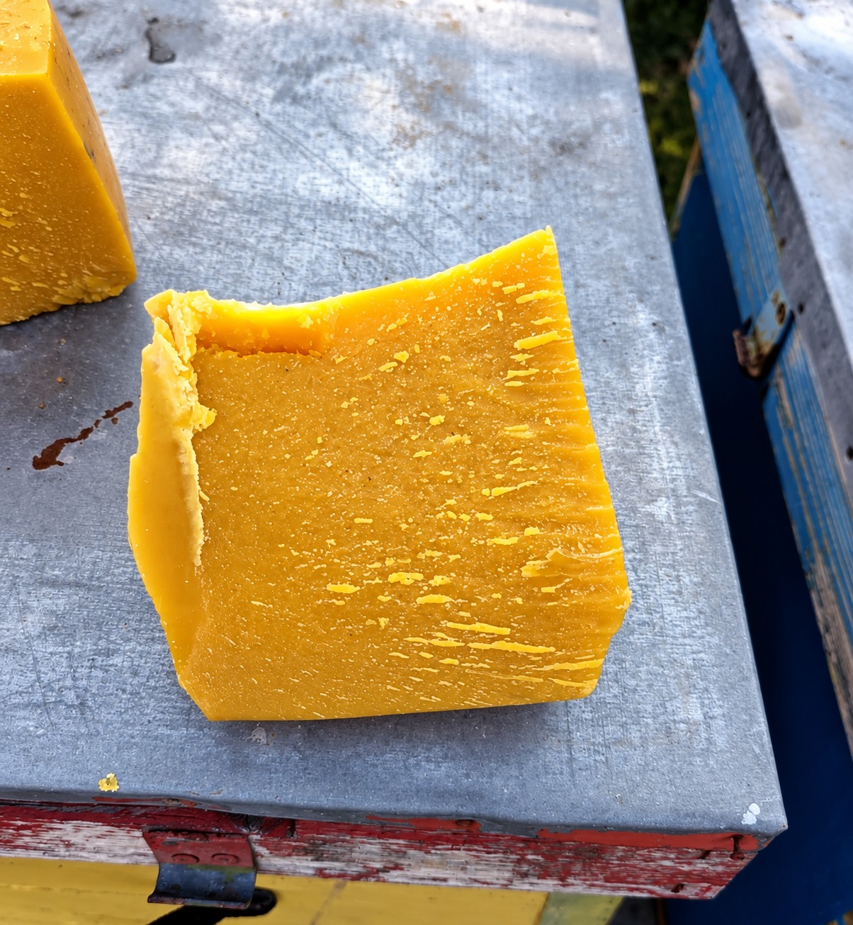 Pure beeswax block photographed on beehive