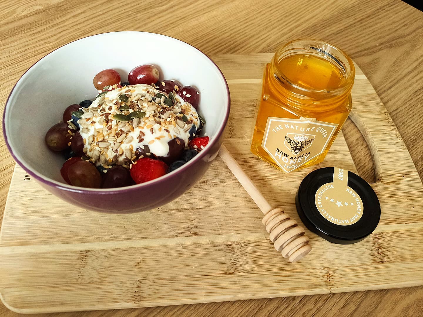 Raw acacia honey with fruit salad
