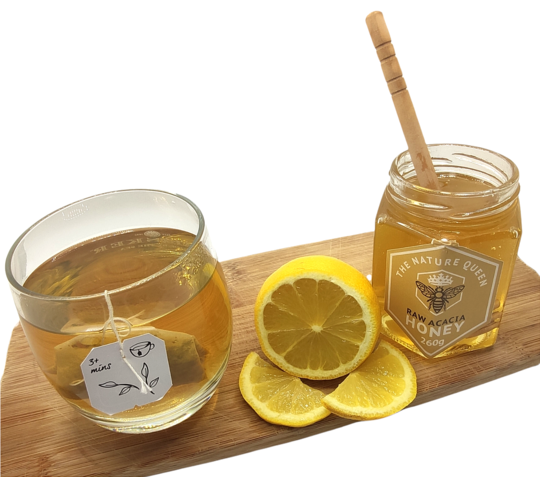 Raw cacia honey with tea and lemon