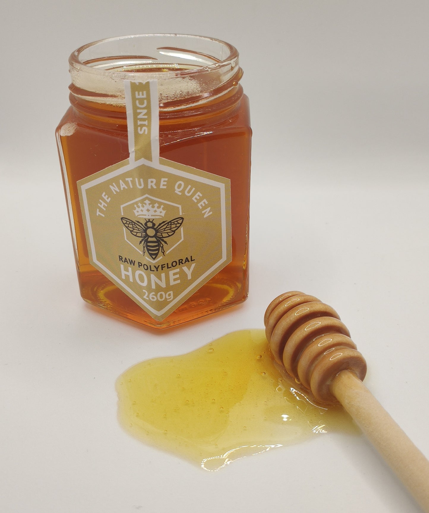 raw polyfloral  honey show on spoon